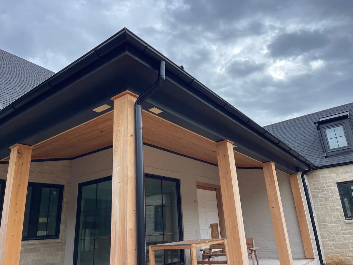 Half round gutter section with a smooth curved profile on a home